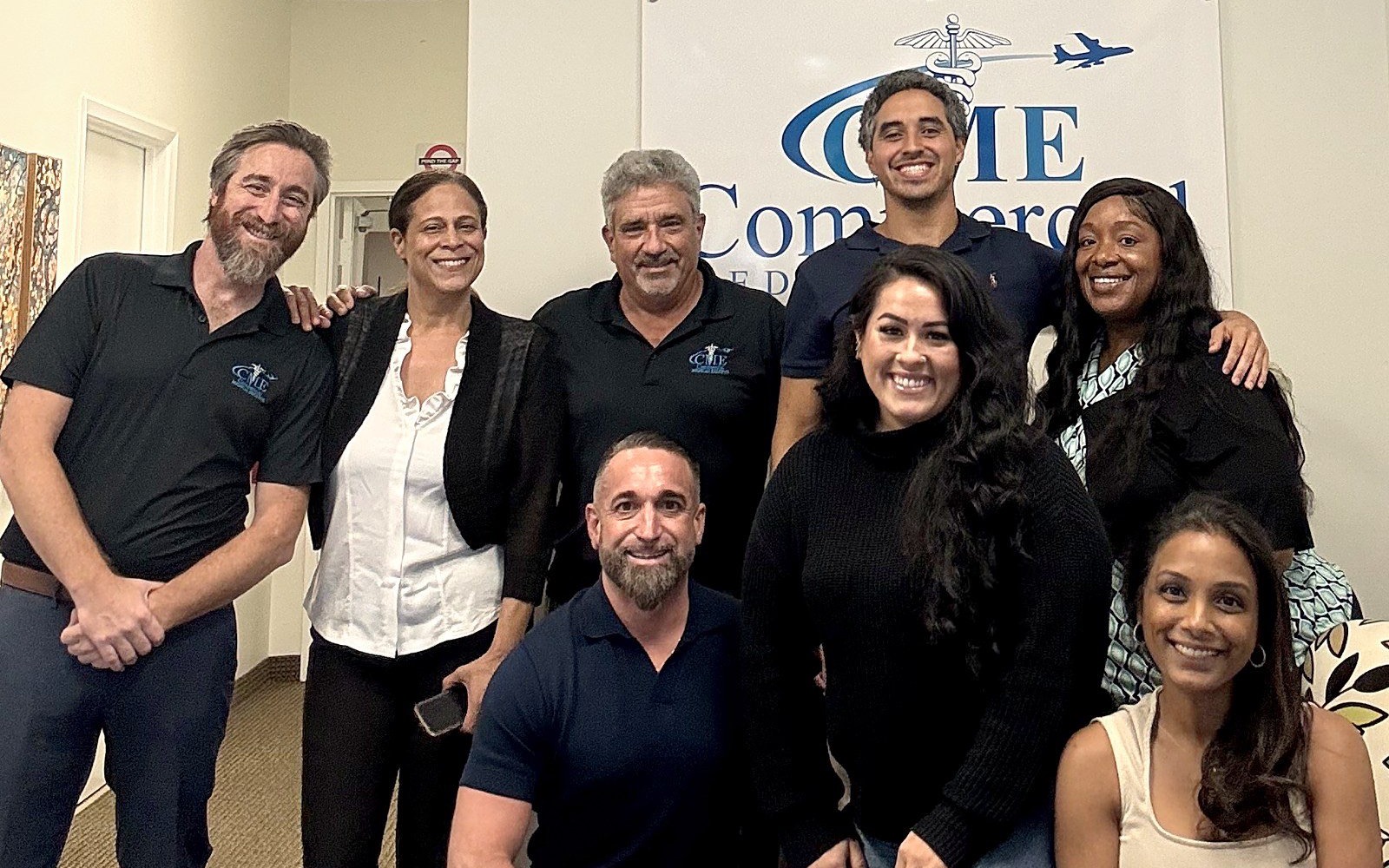 The Commercial Medical Escorts team together at the Pompano Beach office