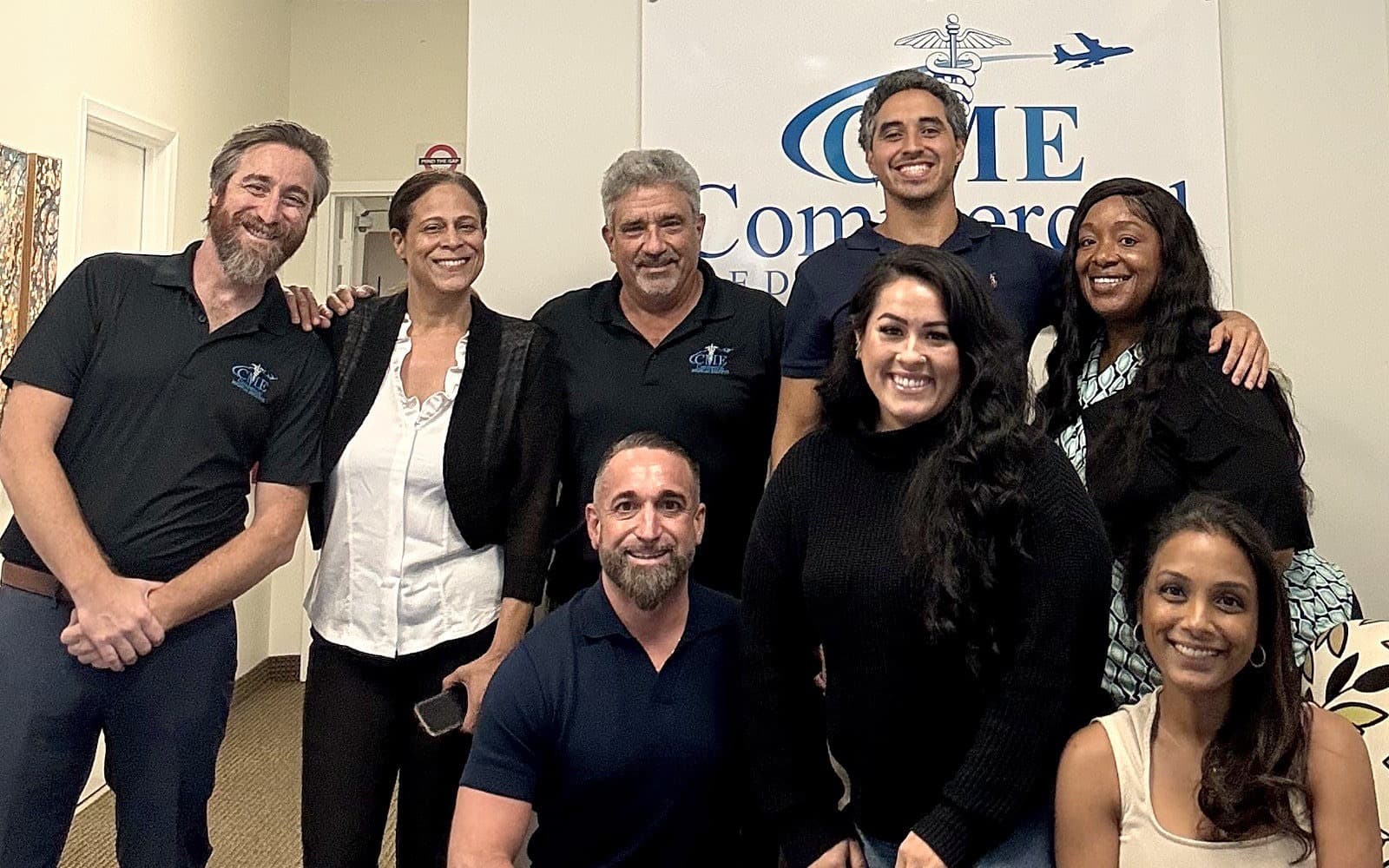 The Commercial Medical Escorts team together at the Pompano Beach office